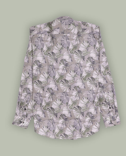 Beige colour shirt adorned with soft green & cream colour floral prints, Designed with a classic collar and full sleeves, this timeless piece offers a crisp and casual look, perfect for both work and weekend wear.