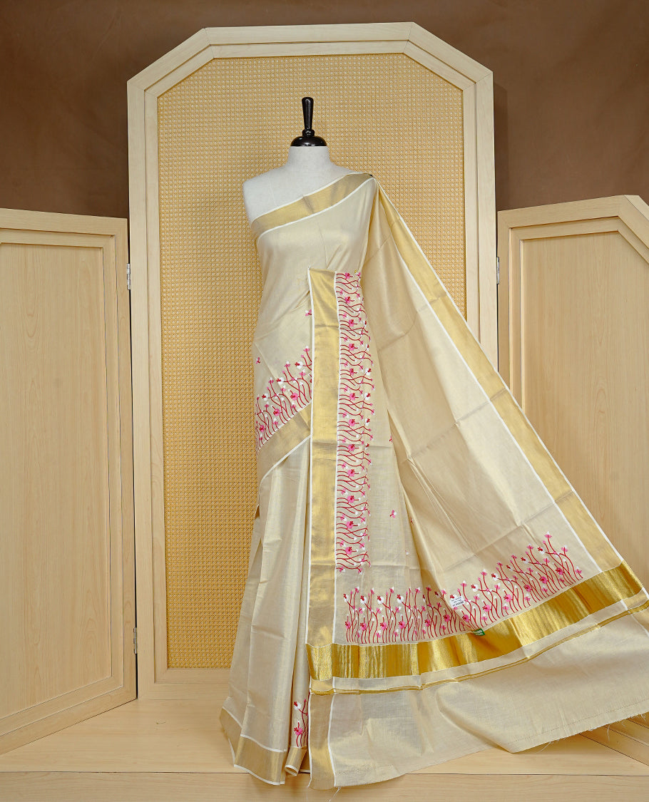 Cream colour Tissue kerala saree featuring Embroidery buttas on body, complemented by Floral thread work & kasavu kara, comes with matching blouse piece.