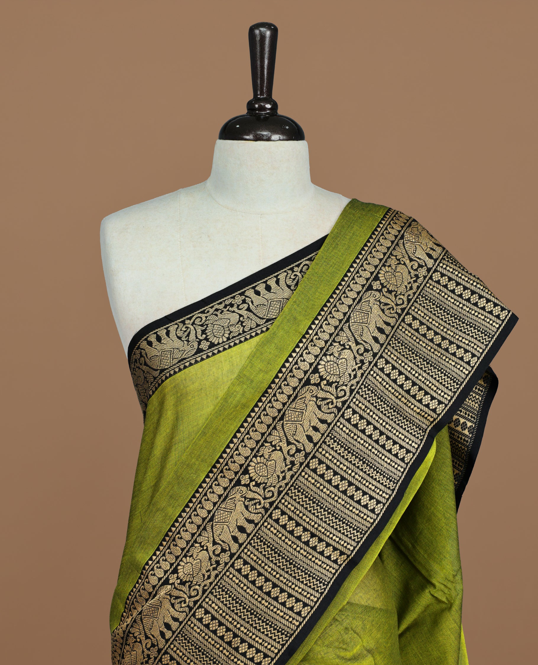 Green colour Narayanapett cotton saree Featuring Elegant plain Body, complemented by Contrast Black colour with cream zari border, paired with matching blouse piece.