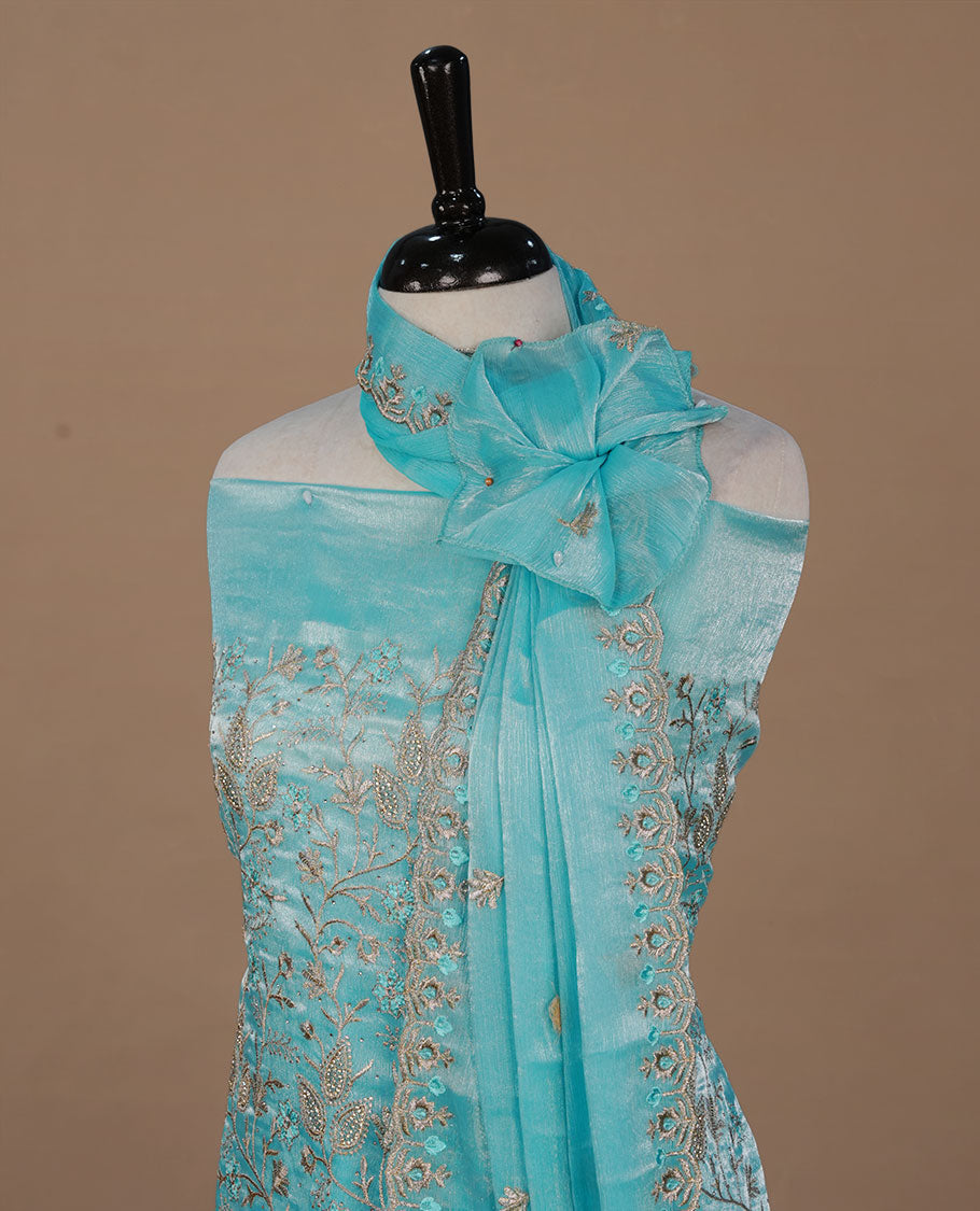 Powder blue colour churidhar material featuring Thread and stone work on body, paired with matching bottom and Dupatta.