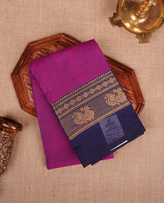Dark Magenta colour chettinad cotton saree featuring plain body, paired with a dark blue colour traditional gold zari border without blouse.