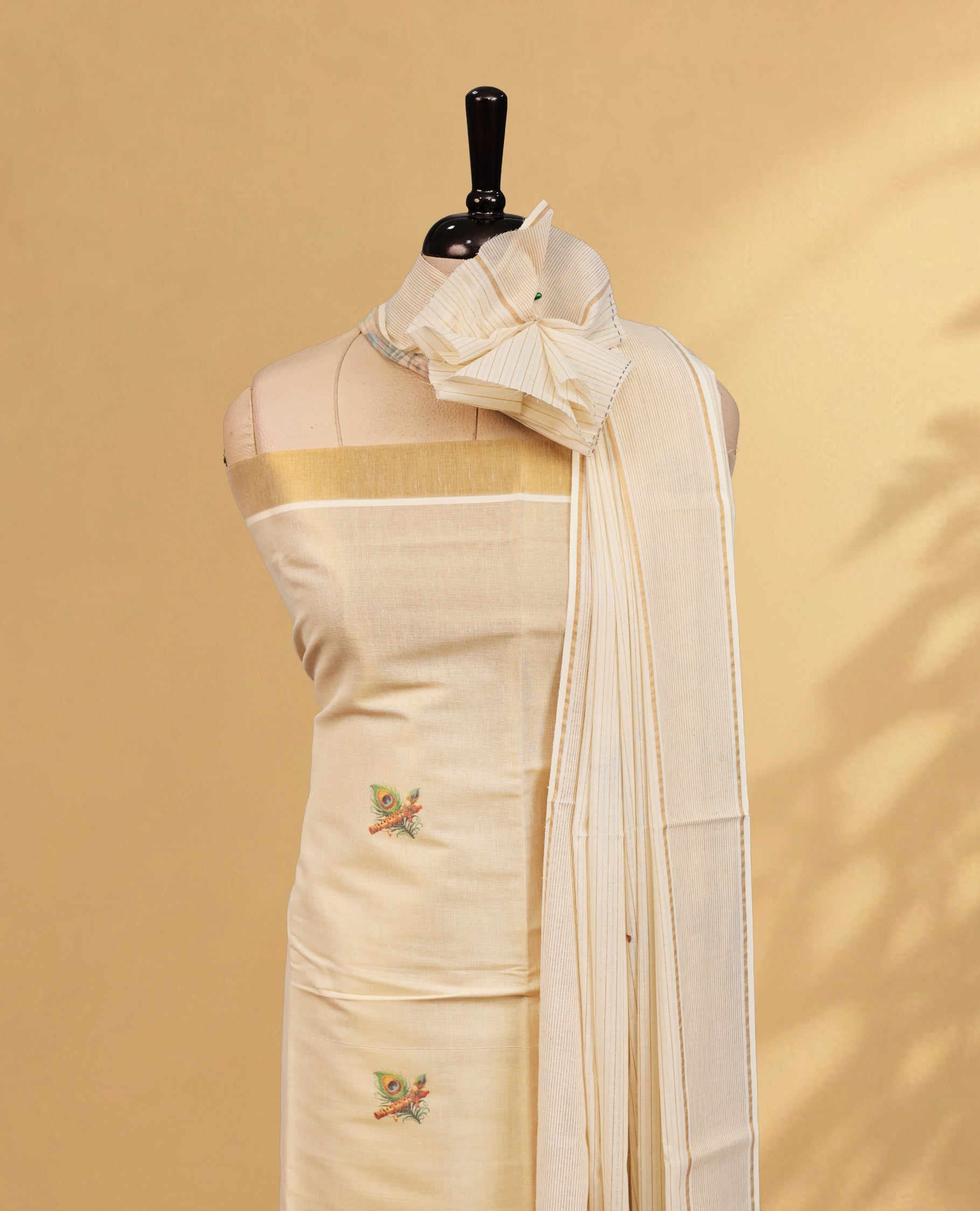 Cream Colour Tissue Salwar Material Featuring Peacock & Flute Print on body, paired with matching Bottom & Elegant Dupatta.