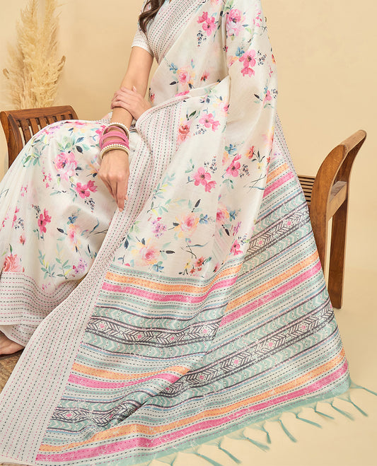 Cream toned semi tussar saree featuring delicate multicolour floral prints on the body, accented with a pastel hued Katha style stitched border and green & grey printed pallu Comes with a matching floral printed blouse for a graceful look.