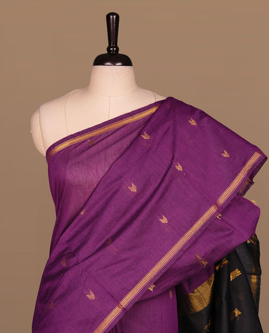Purple colour Maheshwari cotton saree features elegant gold zari motifs across the body, a classic gold zari border, a striking contrast pallu, and a matching blouse piece.