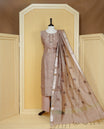 Brown colour Tissue Churidar Set featuring delicate floral embroidery and subtle sequin detailing on the yoke, paired with matching solid pants and dupatta.