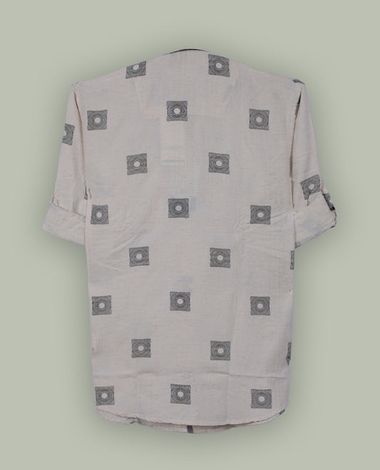 Off white colour shirt adorned with minimal black geometric square prints, Features a classic collar, full sleeves, and a front pocket & perfect for a relaxed yet refined casual look.