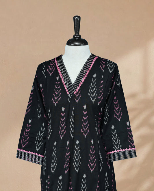 Black Kurti featuring pink and cream prints across the body, a V-shaped neckline with thread detailing, and 3/4 sleeves with a matching design.