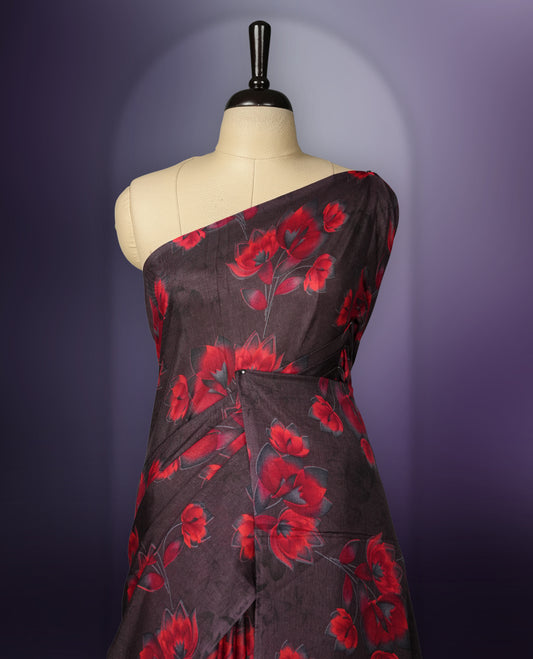 Deep brown colour saree enhanced with a vibrant red colour floral prints on body & pallu, and  comes with a matching blouse.