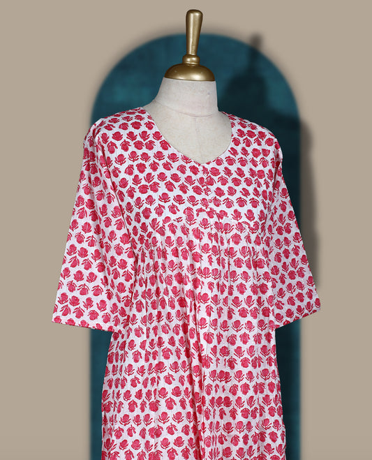 Off white colour kurthi with pink floral block print, round neckline, and 3/4th sleeves & Perfect for casual wear or work from home comfort, Style with leggings or wear solo for a chic look.