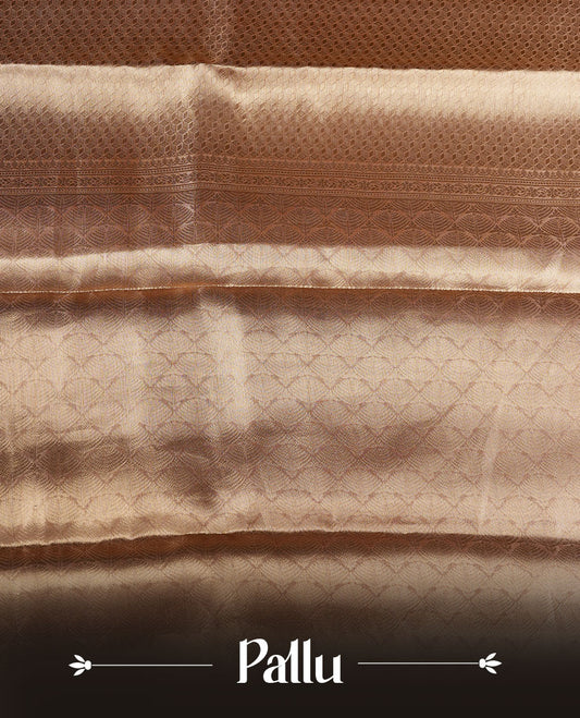 Dark Gold colour Pure banaras tissue silk saree featuring gold zari brocade design across body, with contrast peach colour with silver zari brocade border, finished with a matching blouse.