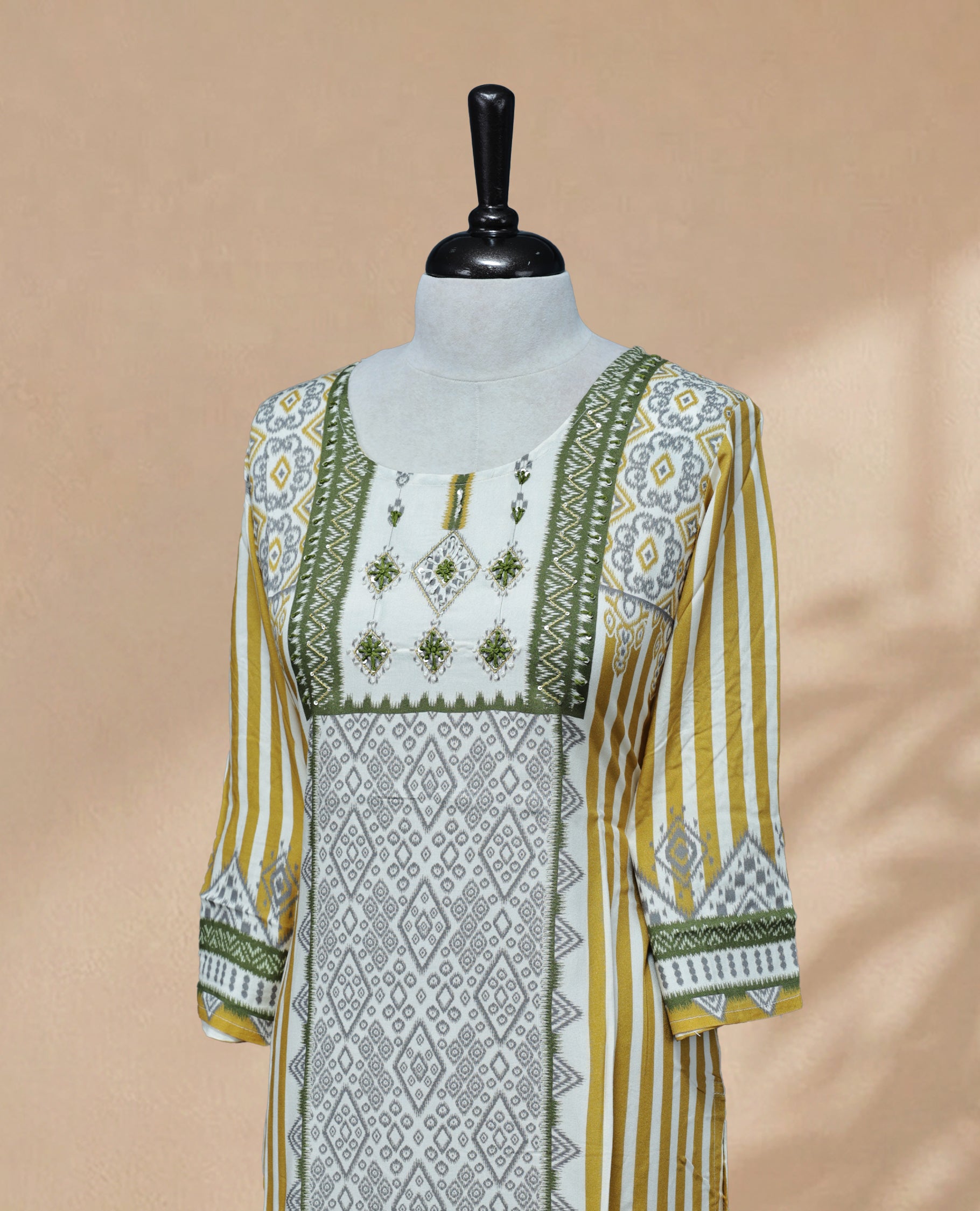 Multicolour kurti featuring a classic U-shaped neckline, intricate embroidery and sequin work on the body, and full sleeves.