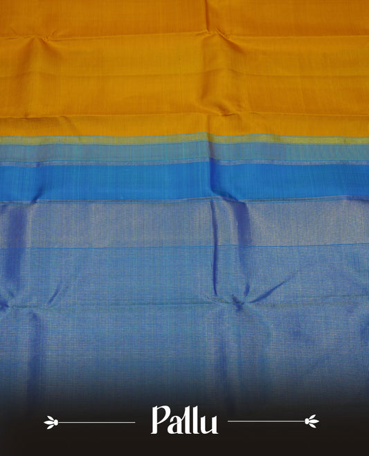 Mustard yellow colour pure traditional Kancheepuram silk saree featuring elegant contrast borders in shades of blue and green with classic zari detailing, beautifully paired with a matching blouse piece