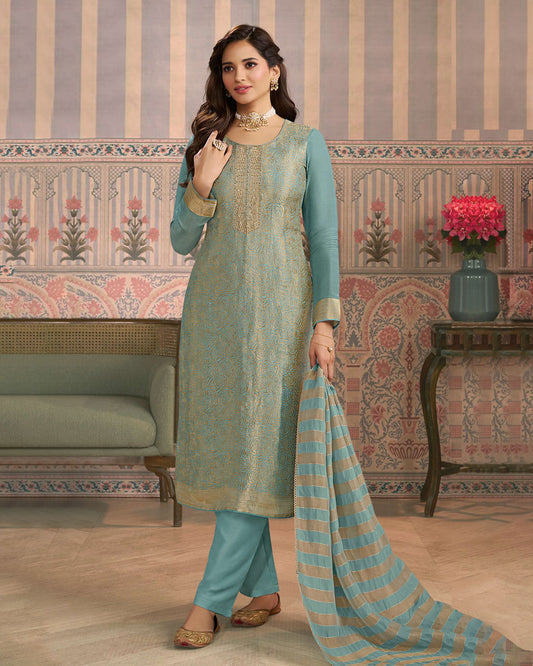 Powder blue colour silk suit material with Gold zari rose petal pattern and stone work, paired with premium soft santoon bottoms and a silk dupatta detailed with stripped work