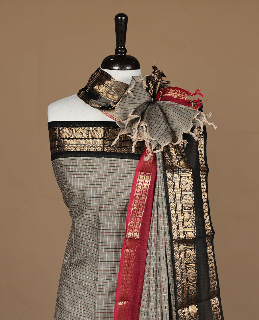 Grey colour chettinad salwar set featuring check pattern on body,contrast red colour with gold zari border, paired with matching bottom and dupatta.