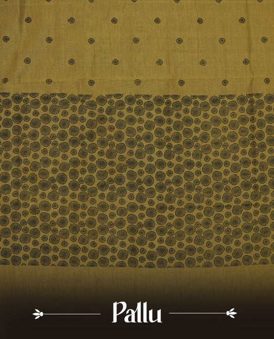Olive green colour poly cotton saree with black abstract butti motifs on the body, paired with a matching pallu with dense black textured round butta pattern, and a coordinated all‑over textured round butta printed blouse piece.