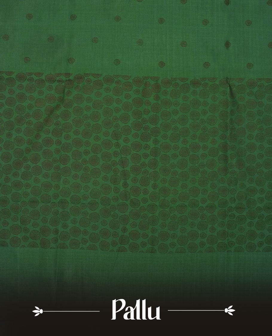 Dark green colour poly cotton saree with black abstract butti motifs on the body, paired with a matching pallu with dense black textured round butta pattern, and a coordinated all‑over textured round butta printed blouse piece.