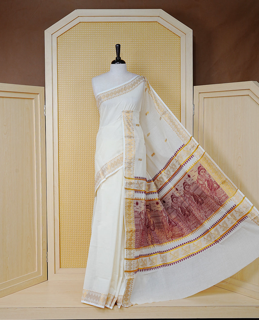 Cream Colour Cotton Kerala Saree Featuring Gold Buttas on the Body, a Classy Gold Zari Border, and a Traditional Maroon Colour Lord Krishna Thread work and Gold Zari Pallu, Paired with a Matching Blouse Piece.