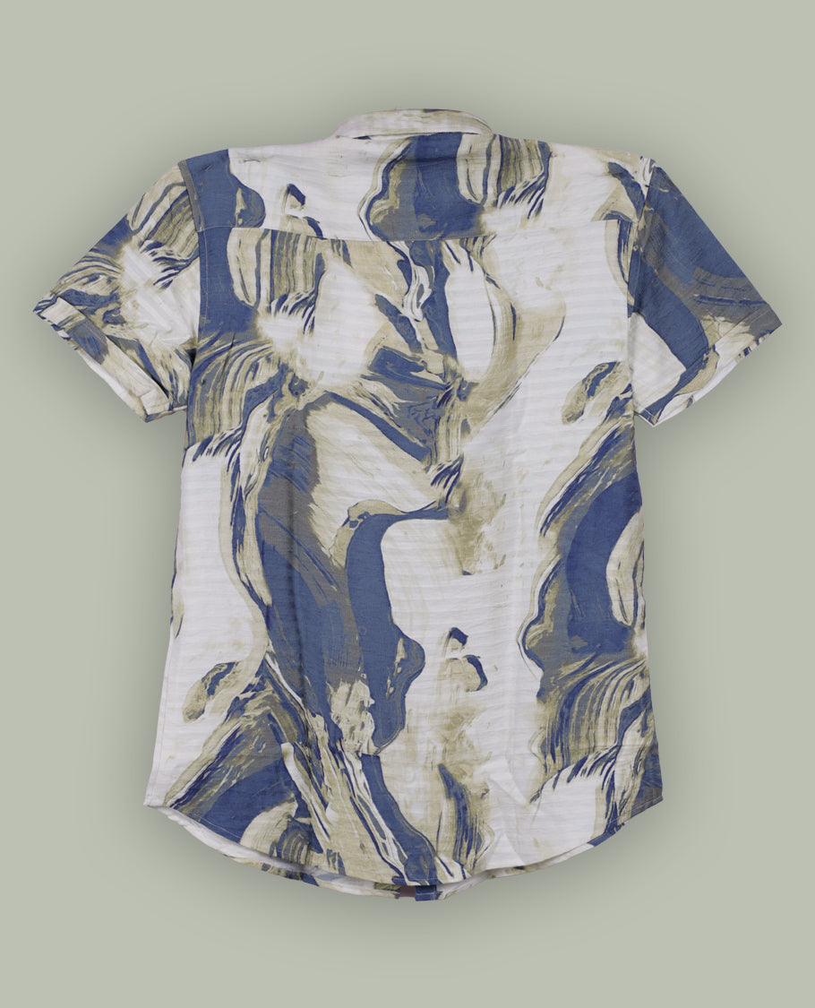 Off white colour shirt features a bold abstract print in blue and white tones, With short sleeves and a button-down front, its made from textured fabric, offering a stylish and modern look.