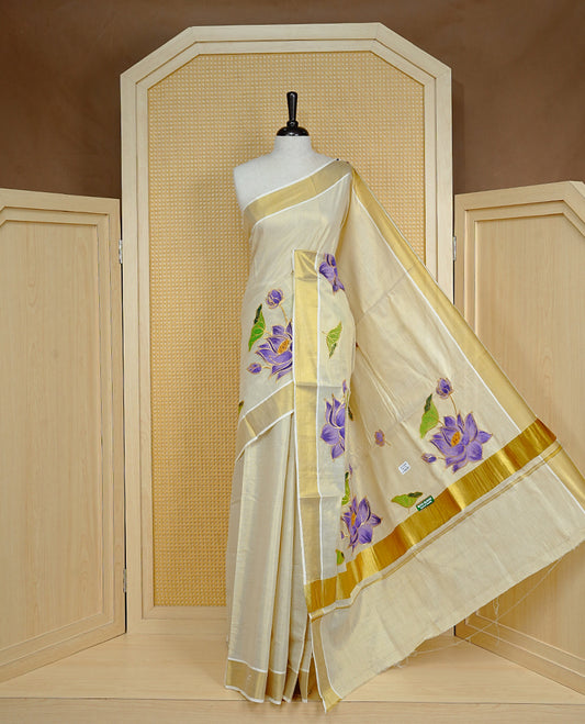 Cream colour Tissue kerala saree featuring Embroidery buttas on body, complemented by Floral thread work with Print & kasavu kara, comes with matching blouse piece.
