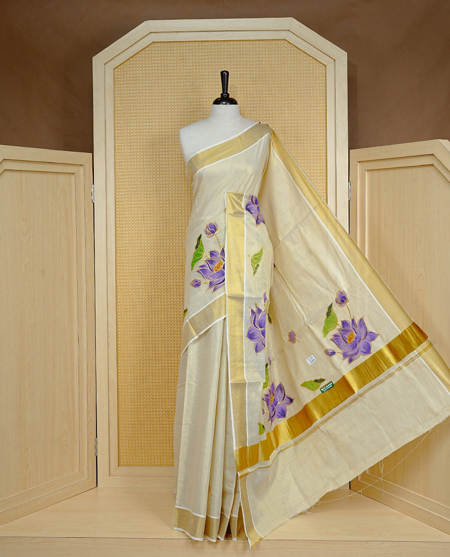 Cream colour Tissue kerala saree featuring Embroidery buttas on body, complemented by Floral thread work with Print & kasavu kara, comes with matching blouse piece.