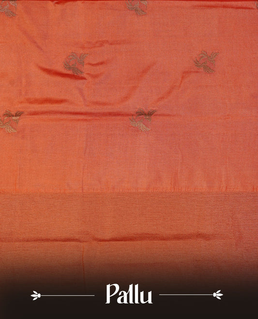 Brick red colour semi banaras tussar silk saree highlighting gold zari bird motifs on body, complemented by self colour with antique zari border, paired with matching blouse piece.