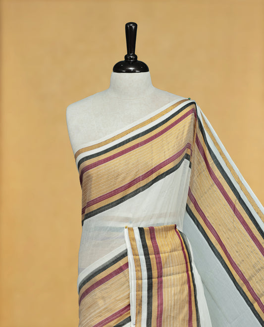 Off White Colour Mul Cotton Saree featuring Elegant Plain Body, Contrast Gold, Wine & black Border and Tassels Onam inspired charm.
