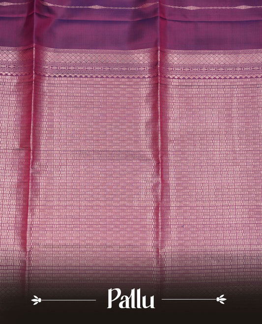 Purple colour soft silk saree featuring gold zari motifs on body, complemented by self colour with traditional border with tassel at pallu, paired with matching blouse piece.