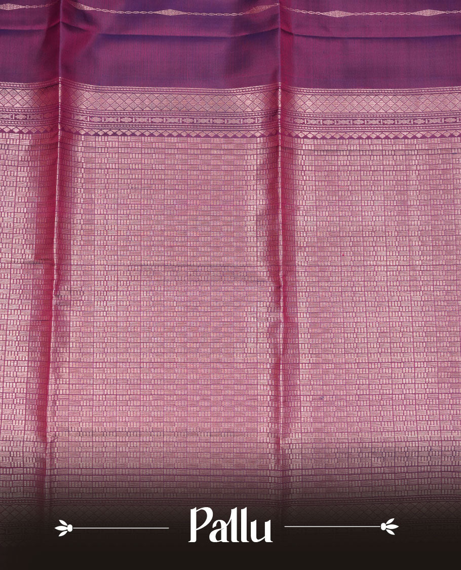 Purple colour soft silk saree featuring gold zari motifs on body, complemented by self colour with traditional border with tassel at pallu, paired with matching blouse piece.