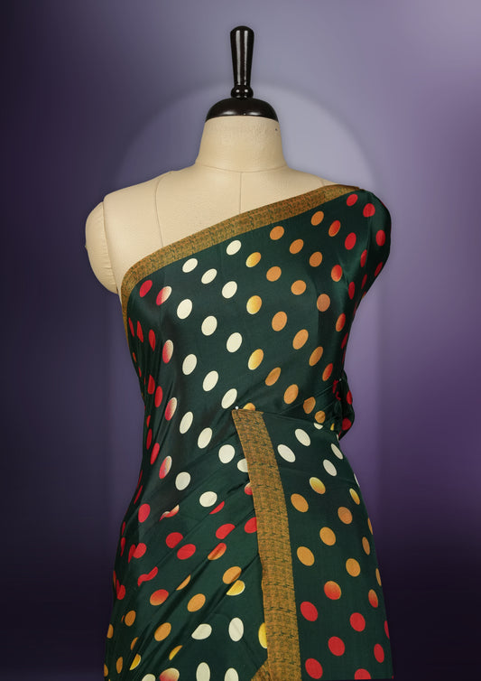 Green colour saree with with large big polka dots on the body, self stripped pallu & Comes with a stylish matching blouse.