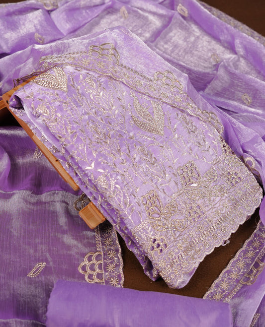 Lavender colour churidar set with stone and thread embroidery and detailing, paired with matching pant and dupatta.