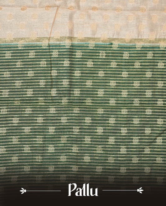 Light Gold Tussar saree featuring Gold zari buttas on body, complemented by contrast dark green Colour with Gold zari border, comes with matching blouse piece.