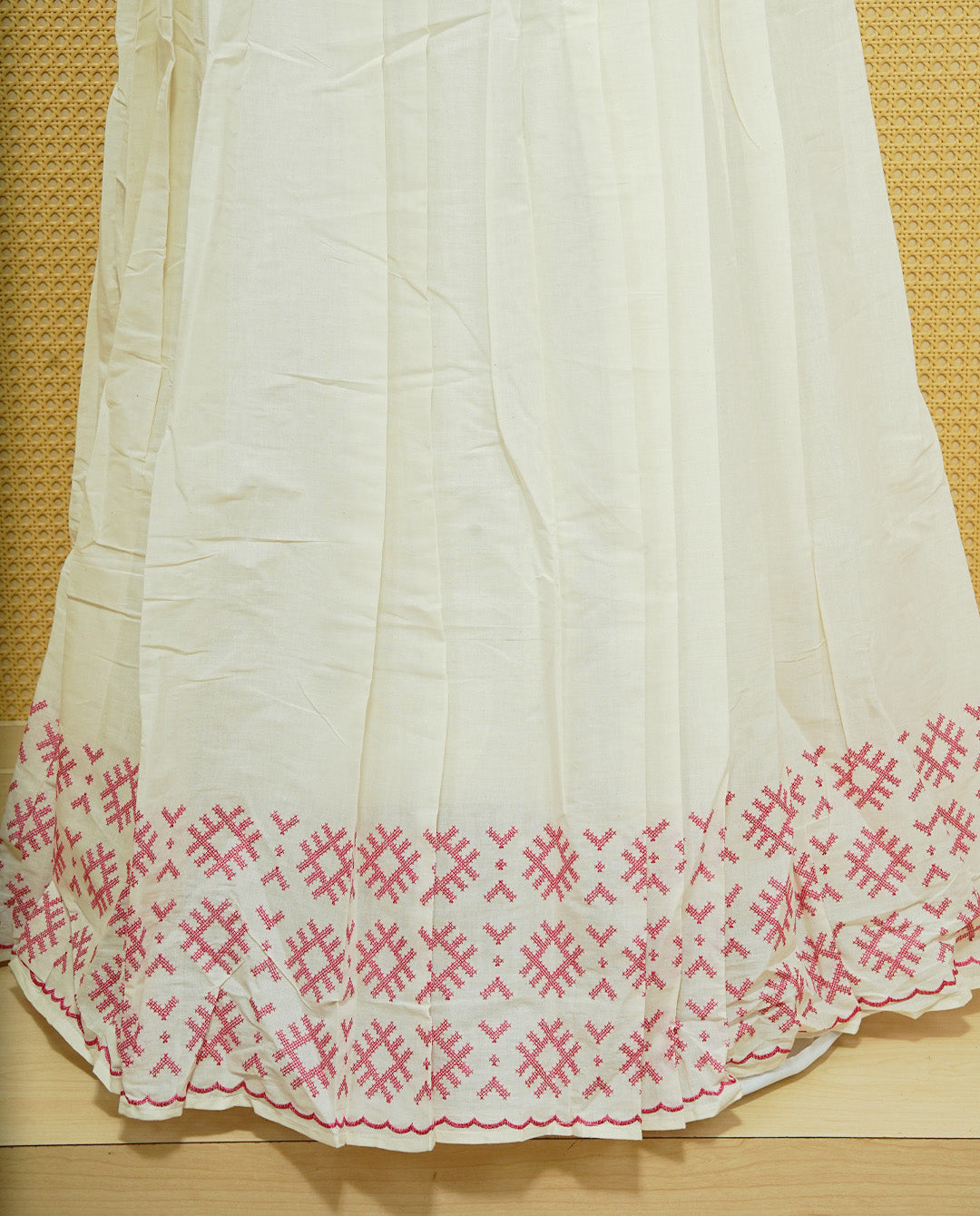 Cream colour cotton Stitched Skirt With Pink colour thread pattern Scallop border.
