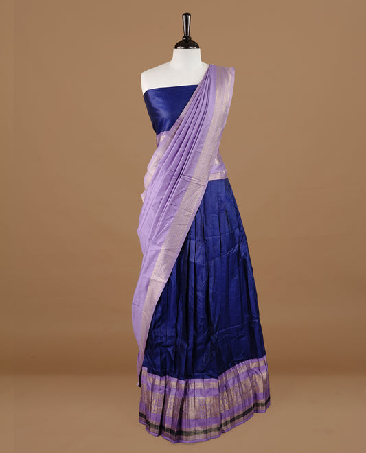 Navy blue colour semi stitched Half saree featuring contrast lavender colour with gold zari traditional border skirt, paired with matching zari border dupatta, unstitched blouse piece