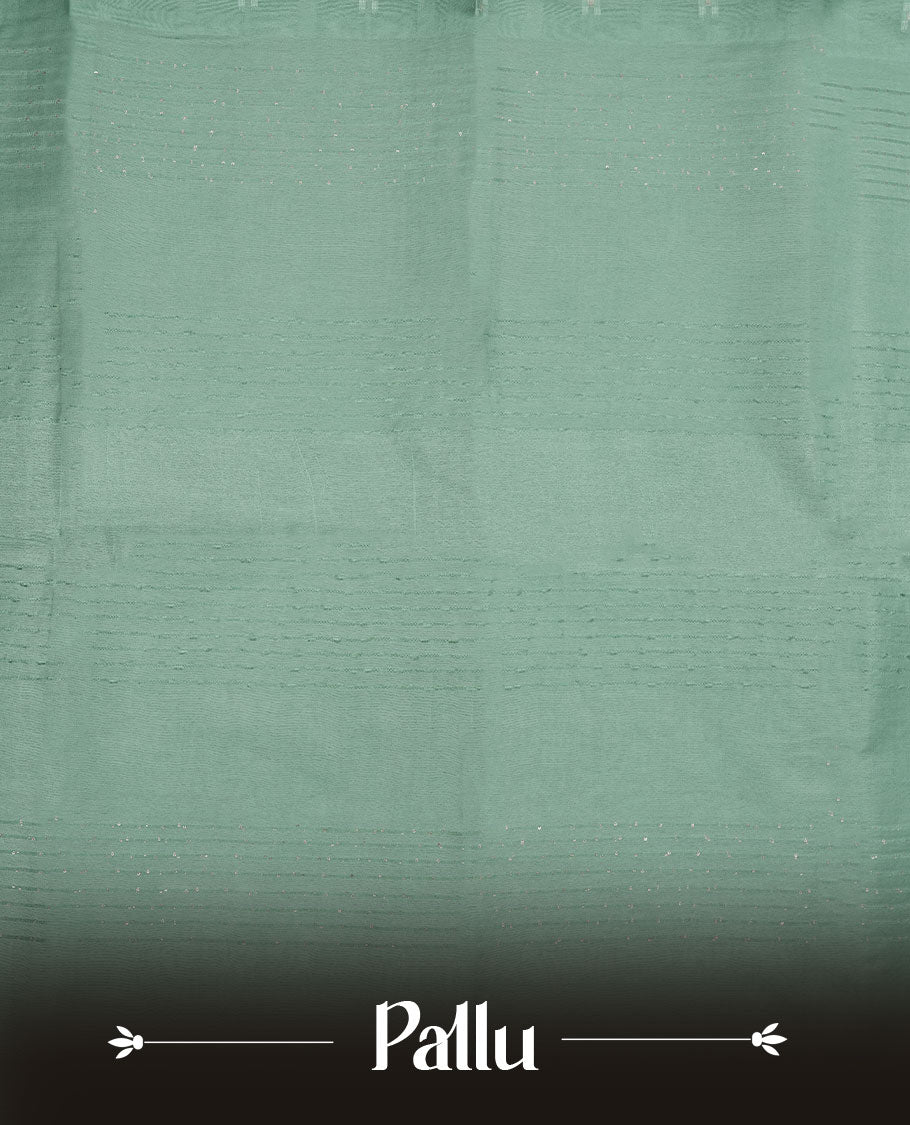 Mint colour semi jute saree highlighting white thread motifs on body, without border and paired with matching blouse.