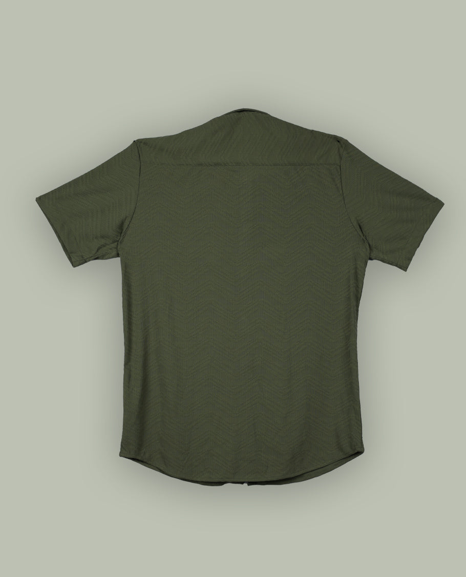 Pastel olive green colour textured shirt featuring a subtle chevron pattern, classic collar, and short sleeves & Crafted for effortless comfort and style.