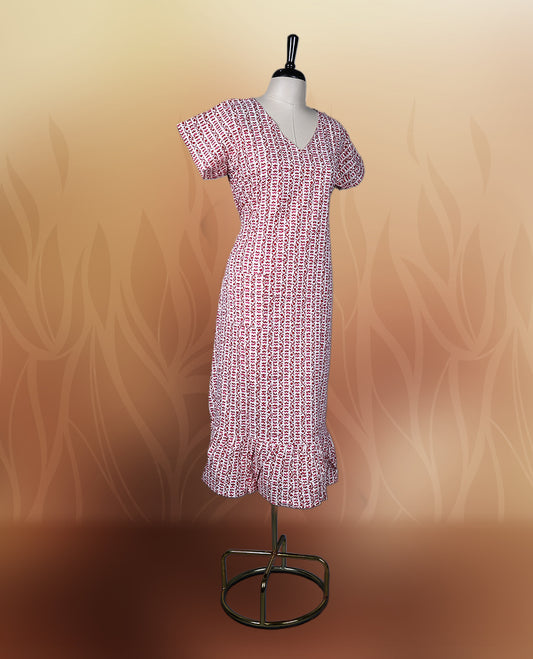 Off white colour kurthi with red and peach colour block style prints, V neckline, and short sleeves, Designed with a flattering silhouette and ruffled hem, perfect for everyday comfort and stylish casual wear.