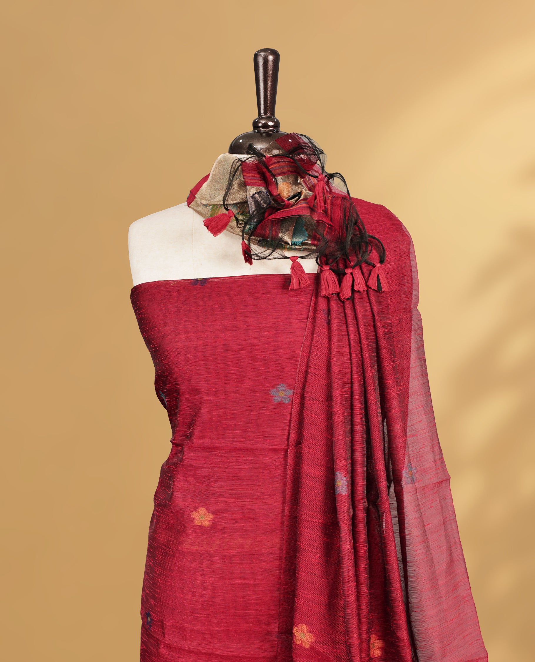 Maroon Colour Salwar material Featuring floral buttas & zari work on body, paired with Matching Bottom and same Patterned Dupatta.