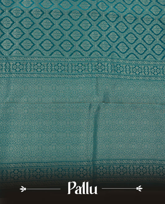 Aqua Blue colour banaras satin crepe saree featuring gold zari pattern across body, with self colour border with gold zari pattern and paired with matching blouse.