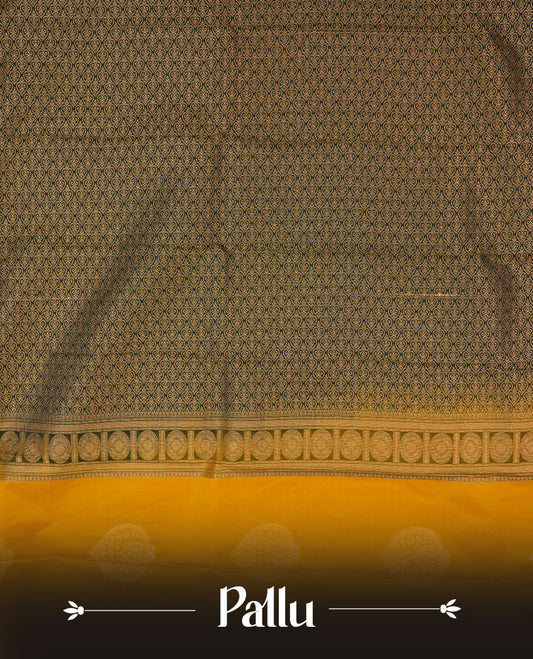 Mustrad yellow colour semi silk saree highlighting gold zari motifs across body, featuring contrast Dark green colour border with gold zari pattern, comes with matching blouse.