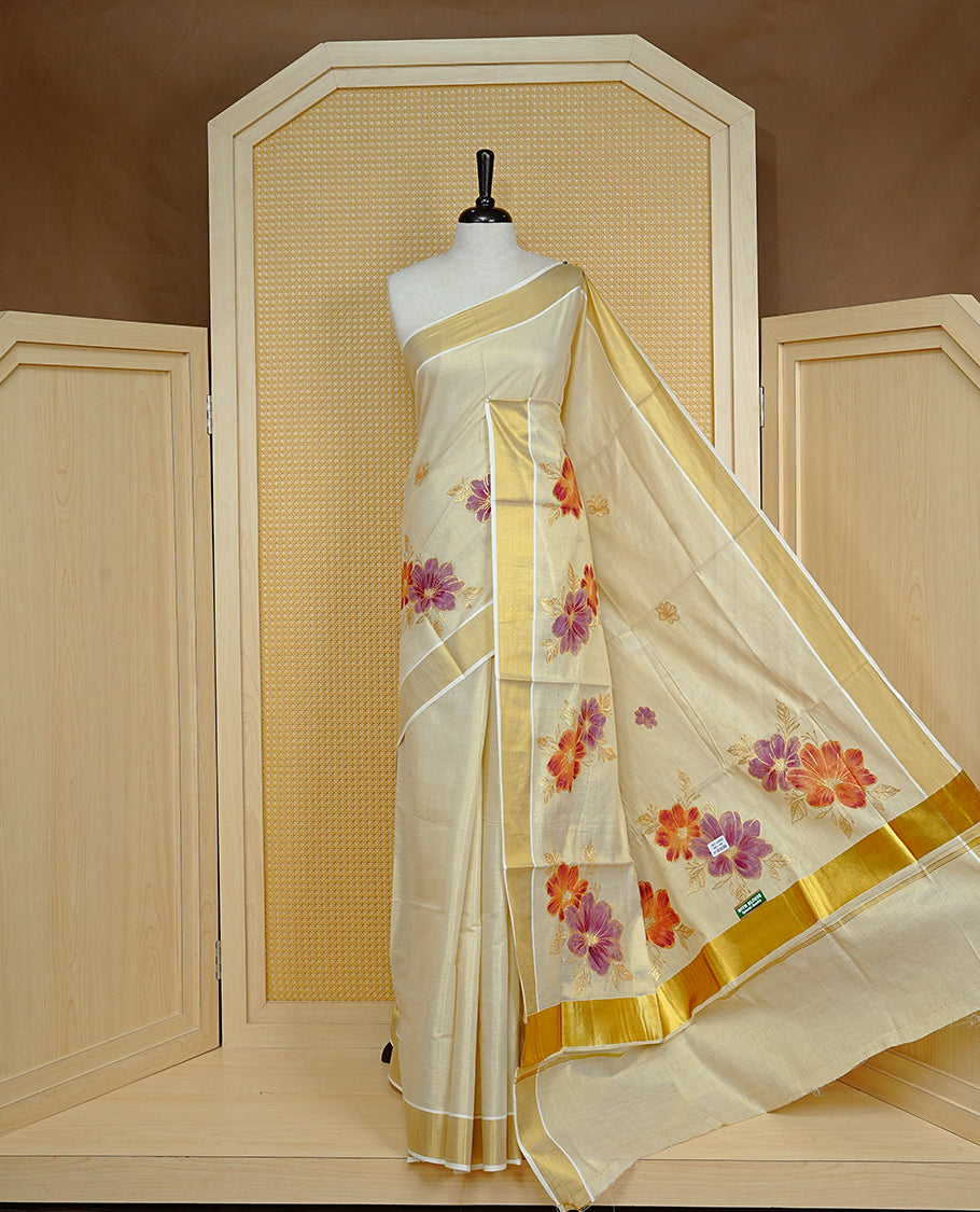 Cream colour Tissue kerala saree featuring Embroidery buttas on body, complemented by Floral thread work with Print & kasavu kara, comes with matching blouse piece.