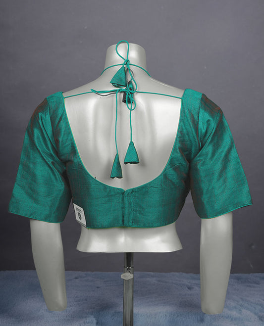 Teal green colour silk padded readymade blouse with elbow length sleeves, a V-neck front, and a deep U-back with tie-up dori.