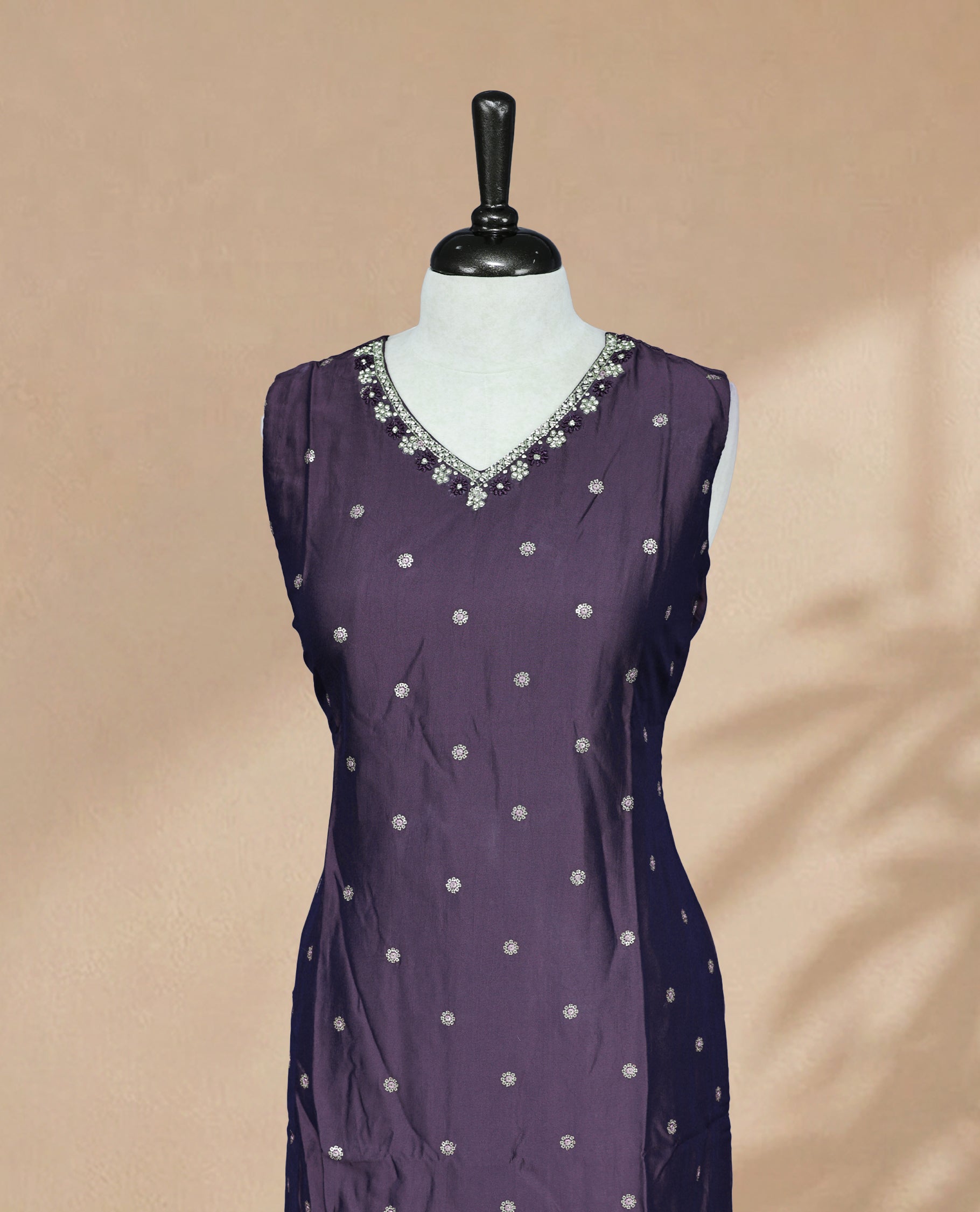 Deep Purple Kurti featuring sequin work on the body, a V-shaped neckline adorned with stone and beadwork, and a sleeveless design.