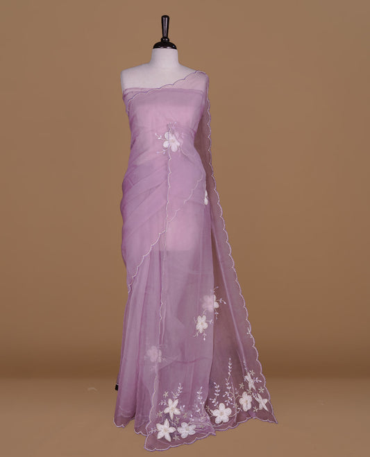 Pastel lavender colour crush organza saree featuring white floral work with beats & sequins, highlighting scalp with beats worked border, paired with matching blouse piece.
