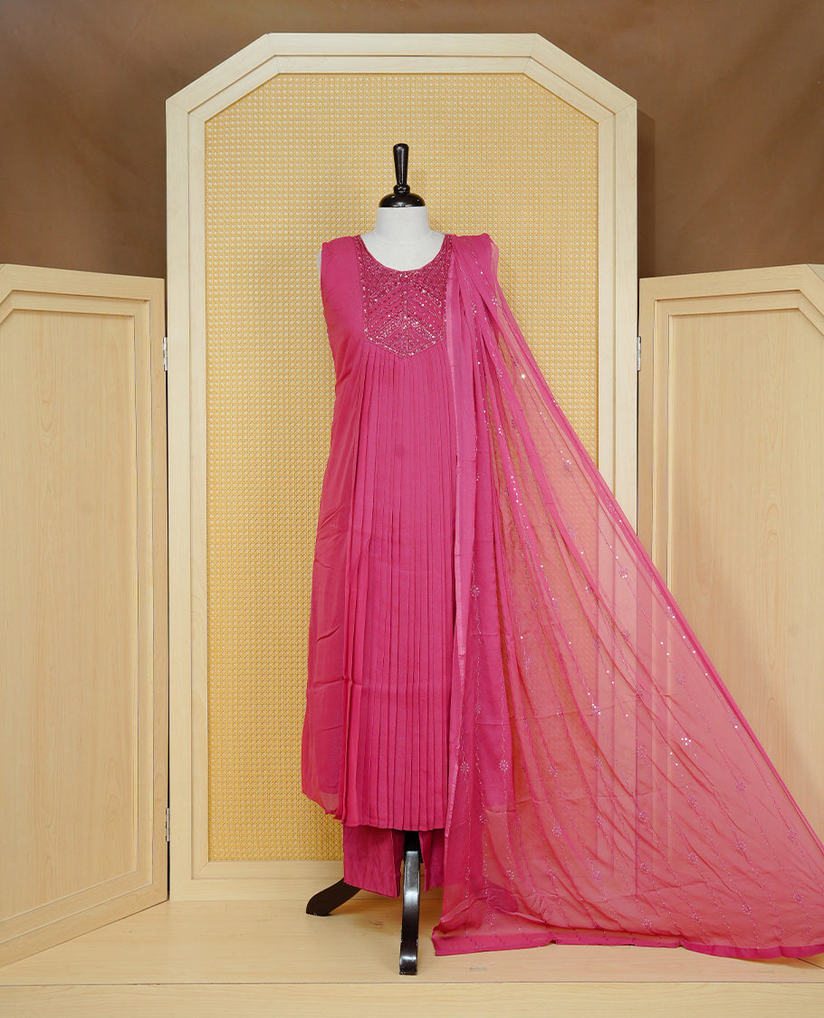 Mauve pink colour pleated churidar set featuring intricate bead and sequin embroidery on the yoke, paired with matching solid pants and dupatta.