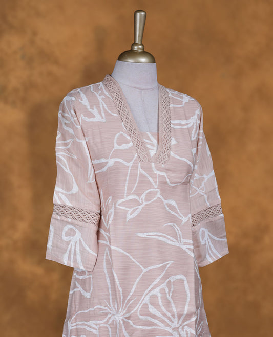 Cream tan colour kurti with white colour floral pattern, knee length design, styled with a V neckline and a  sleeve .