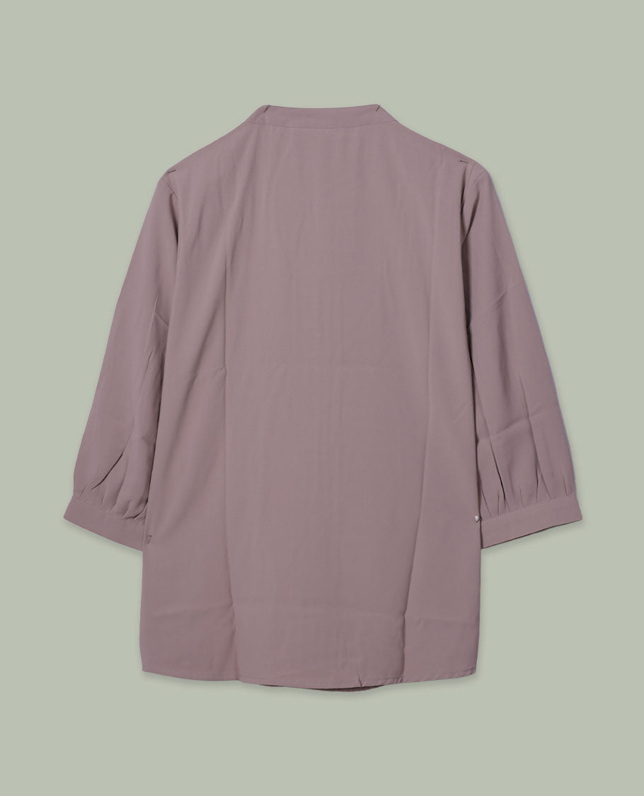 Mauve colour solid top featuring a band collar with a half button placket, soft pleat detailing at the front, and three-quarter sleeves.