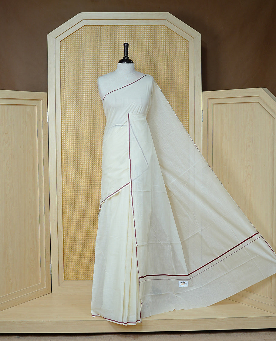 Cream Colour Cotton Kerala Saree Featuring A Classy Plain Body For Effortless Elegance, Enhanced By A Minimalist Maroon Border, Paired With A Matching Blouse Piece.