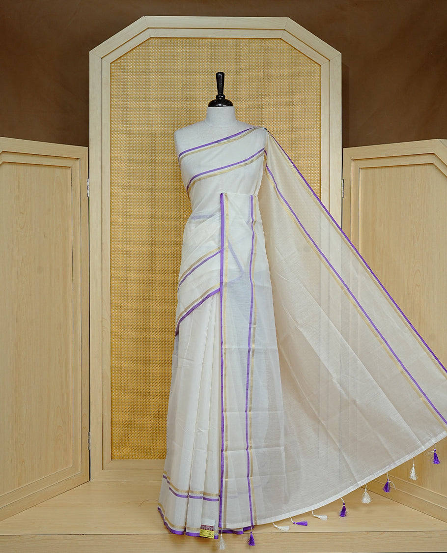 Off white colour semi linen saree featuring Elegant Plain body, complemented by contrast Purple colour with gold zari Simple border, comes with matching blouse piece.