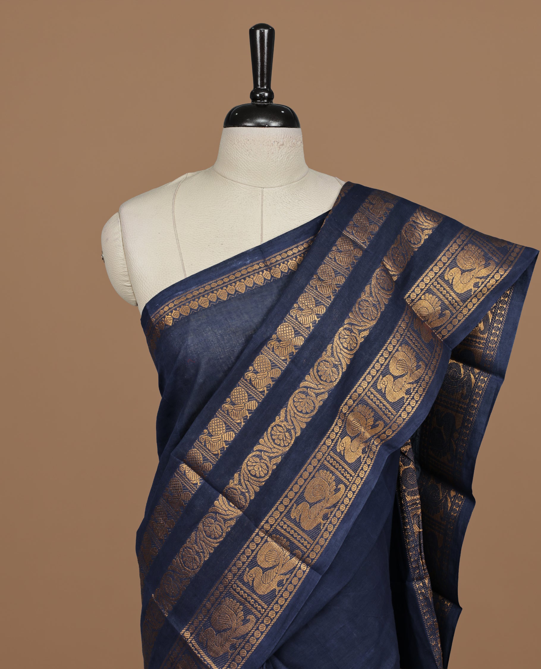 Dark Blue colour sungudi cotton saree featuring elegant plain body, complemented by Traditional border on self color , paired with matching blouse piece.