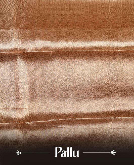 Dark Gold colour Pure banaras tissue silk saree featuring Silver zari brocade design across body, with contrast peach colour with gold zari brocade border, finished with a matching blouse.